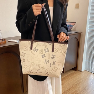 Chic off-white tote bag with leopard print lettering and spacious commuter design