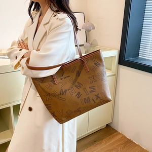 Brown large capacity tote bag with monogram print and shoulder strap for work