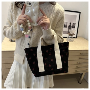 Black corduroy strawberry print tote bag with cream handles for casual school style