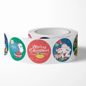 Roll of colorful cartoon Christmas stickers featuring Santa and festive animal designs
