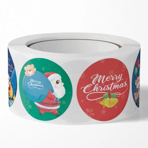 Roll of Christmas themed stickers featuring Santa Claus and holiday motifs on white backdrop