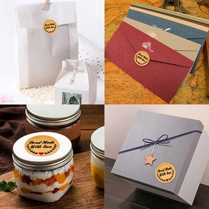 Handmade with Love kraft paper stickers shown on gift boxes and envelopes for bakery packing