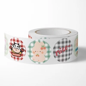 Detail view of cartoon bear sticker roll with grid patterns and cute animal characters