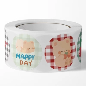 Close-up of cute cartoon bear stickers in a roll for DIY scrapbooking and sealing