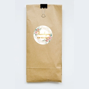 Floral 1.5in thank you stickers with gold foil frame and pink roses on paper bag