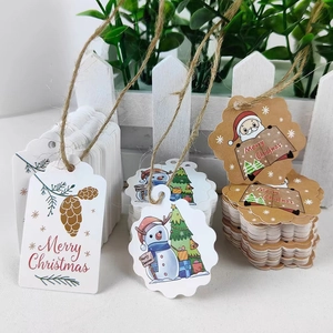 Christmas Kraft paper gift tags set with Santa Claus and twine for holiday packaging