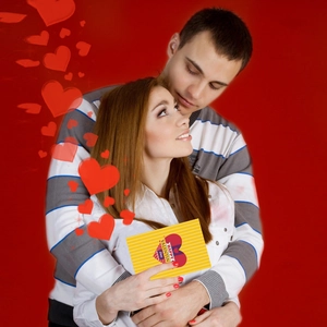 Yellow Happy Valentine's Day card with multi-colored hearts held by a couple