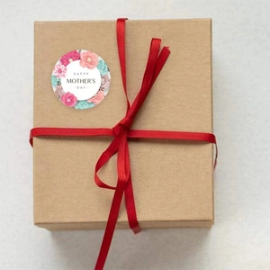 Floral Happy Mother's Day round gift sticker on a brown kraft box with red ribbon
