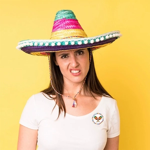 Colorful Mexican sombrero hat with white pom-poms for children summer themed parties