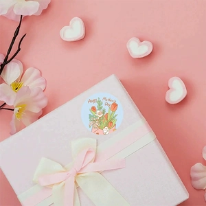 Circular Mother's Day sticker with tulip bouquet on a gift box with pink background
