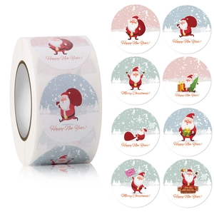 Detail of Christmas and New Year round stickers roll with cartoon Santa Claus patterns