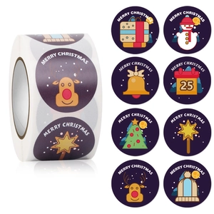 Detail of Christmas adhesive roll stickers with reindeer and snowman patterns for gift sealing