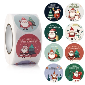 Detail view of 8 different Christmas round stickers on a roll with festive cartoon designs