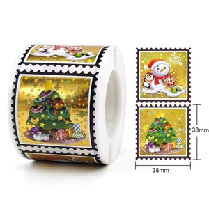 Laser Christmas stickers 38mm roll featuring Merry Christmas trees and reindeer motifs