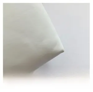 Detail shot of the white high-density fabric texture on the vintage crossbody bag