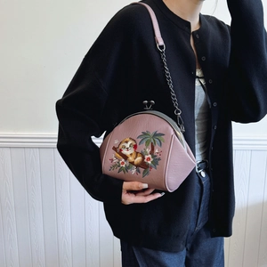 Embroidered shell crossbody bag with loris motif and vintage metal chain strap