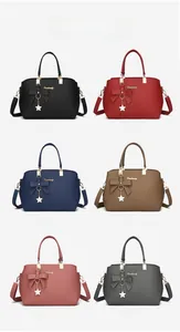 Detailed view of lychee leather tote bag colors including black, red, and blue options