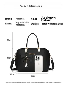 Detail view of black litchi pattern handbag with bow pendant and size reference