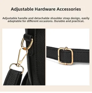 Detail of adjustable golden hardware and lobster clasp on black lychee leather bag