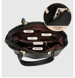 Detailed interior view of black lychee leather handbag showing compartments and back zip pocket