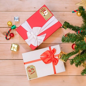 Kraft Christmas stickers on gift box with Santa Claus and candy cane designs