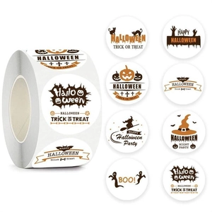 Detail view of round Halloween roll stickers featuring pumpkins and ghosts on white background