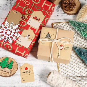 Detail of Christmas kraft gift tags with snowman and Santa patterns on a gift box