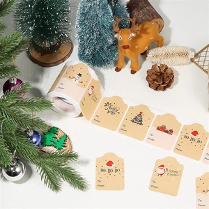 Close-up of vintage kraft Christmas gift labels with snowman and Santa illustrations