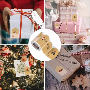 Detail of Christmas kraft paper gift tags with Santa motifs and To-From labels on rolls