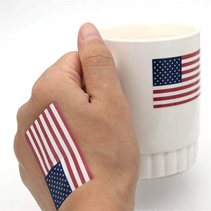 Patriotic USA flag stickers 1.22x2 inch on ceramic mug and hand for Independence Day
