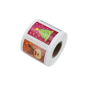 Roll of festive Christmas stickers featuring Santa and reindeer for gift packaging
