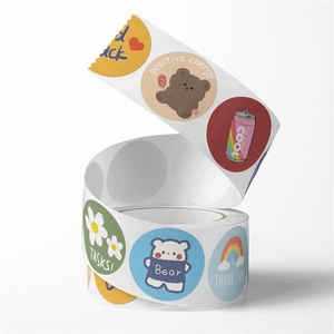 Detail of round cartoon stickers roll with bear dog and thank you designs for DIY crafts