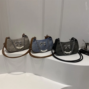 Denim underarm bag with chain, pearls, and bow in taupe, blue, and black colors