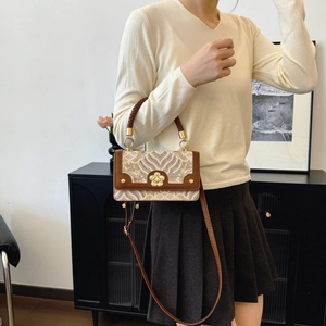 Retro jacquard kleine vierkante crossbodytas met bruin leer en bloemvormige gouden sluiting