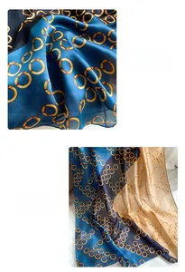 Detail of rolled edges and chain link print on blue and gold silk feel scarf