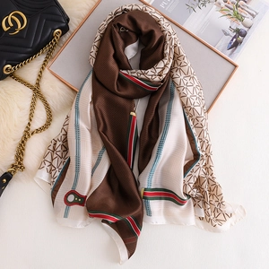 Detailed macro shot of elegant faux silk chain pattern scarf on a stylish background