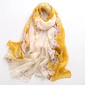 Elegant yellow and white gradient floral silk scarf with delicate cherry blossom patterns