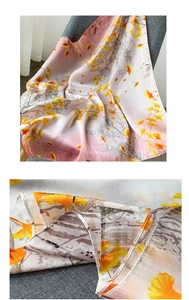 Détail d'un foulard en soie rose montrant la texture lisse et l'imprimé ginkgo