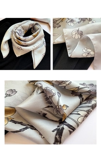 Détails de l'écharpe en soie avec motifs floraux élégants et finitions de bordure soignées