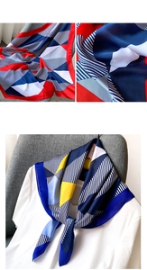 Détail d'un foulard en soie avec motifs géométriques et design à blocs de couleurs