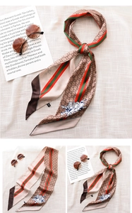 Macro detail of silk scarf featuring striped patterns and vintage cartoon motifs