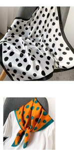 Détail de foulards à pois soyeux en blanc et orange avec une texture satinée lisse