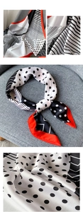 Détail d'un foulard satiné avec pois géométriques, rayures et bordure rouge vif