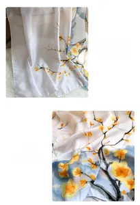 Detailed view of precision stitching and ginkgo leaf print on soft silk scarf