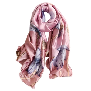 Pink silk scarf featuring elegant purple lotus flowers and a smooth satin finish