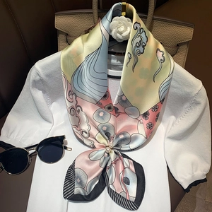 Elegant floral silk scarf with pink and yellow prints featuring a pearl buckle fastener