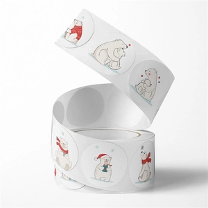 Macro view of round cartoon polar bear stickers on a roll for teacher rewards and sealing
