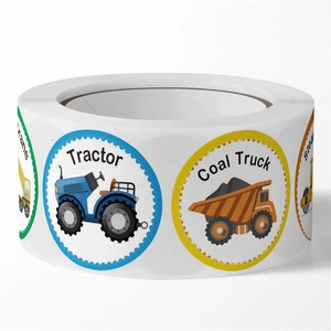 Close-up of circular children stickers featuring cartoon construction vehicles on a roll