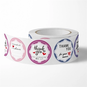 Close-up of floral gift stickers with Homemade with Love and Thank You texts