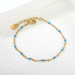Golden stainless steel chain bracelet with bright blue enamel beads and lobster clasp